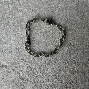 Handmade textured rolo chain silver bracelet with garnet accent.